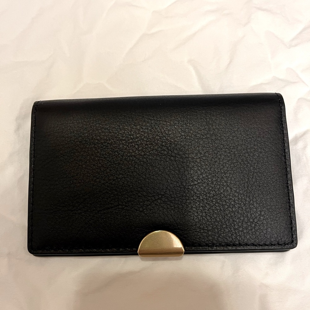 Coach dreamer wallet in black pebbled leather with brass hardware